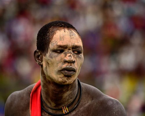 TO GO WITH AFP STORY BY PETER MARTELL 
A wrestler from Jonglei state takes part in the South Sudan National Wrestling Competition for peace at Juba Stadium, on April 20, 2016. 
South Sudan is holding a wrestling for peace tournament, bringing together athletes from around the country. The last big tournament was canceled when civil war broke out in December 2013.  / AFP / CARL DE SOUZA        (Photo credit should read CARL DE SOUZA/AFP via Getty Images)